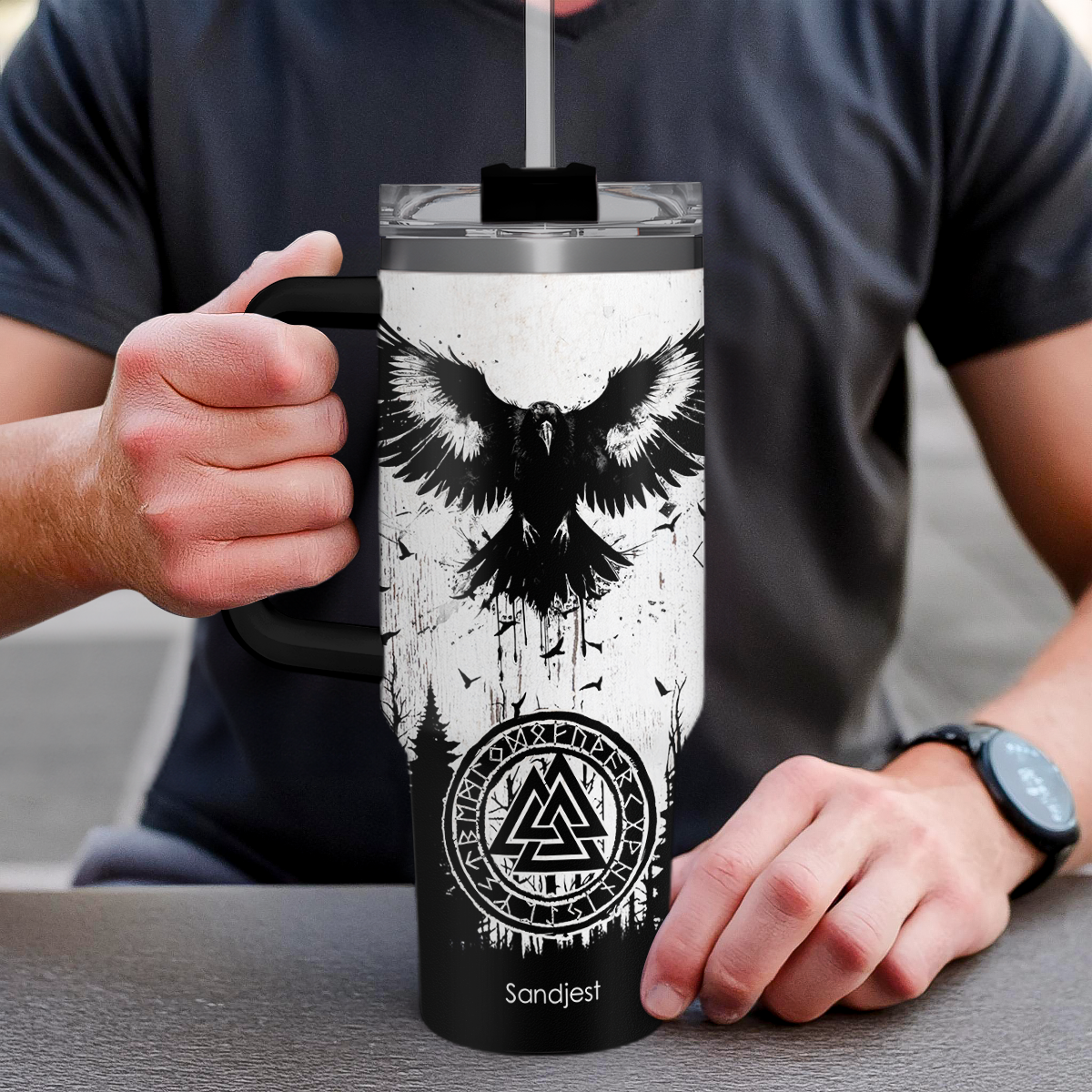 Hand holding 40oz stainless steel tumbler with handle, black lid, owl graphic