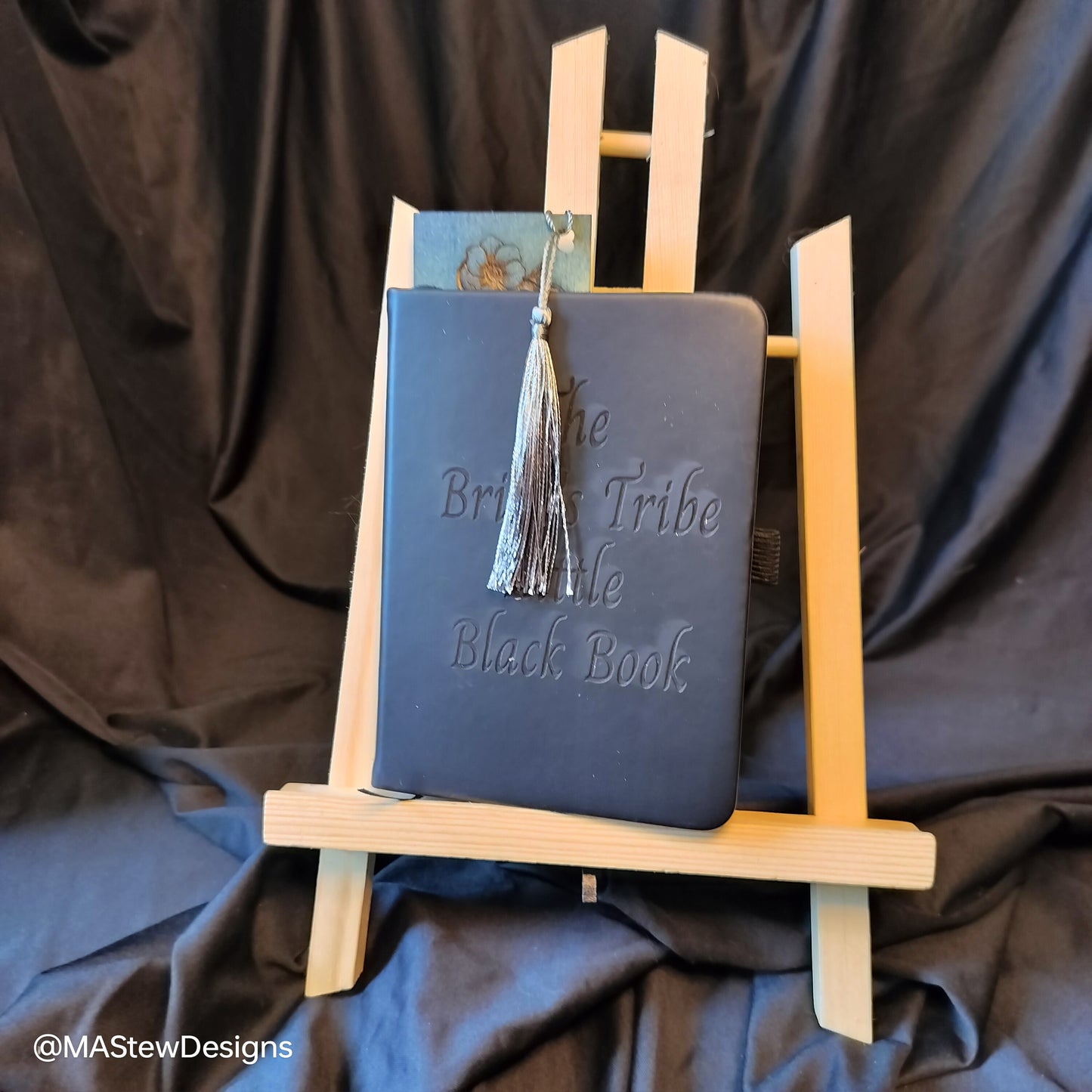 Blue wood bookmark with engraved script and hanging tassel, vertical design