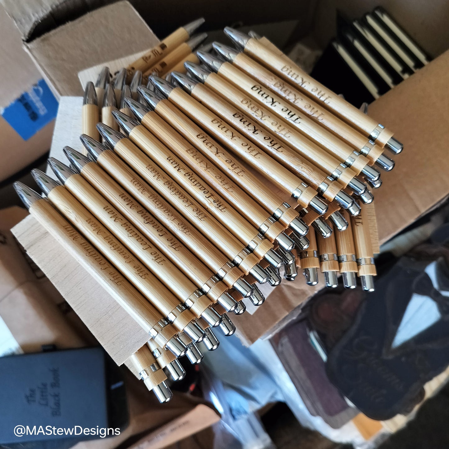 Set of engraved bamboo pens with silver tips and clip, personalized text on barrels.