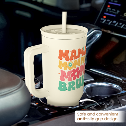 Cream tumbler with handle and straw; anti-slip grip design and “MAMA MOMMY BRUH” graphic.
