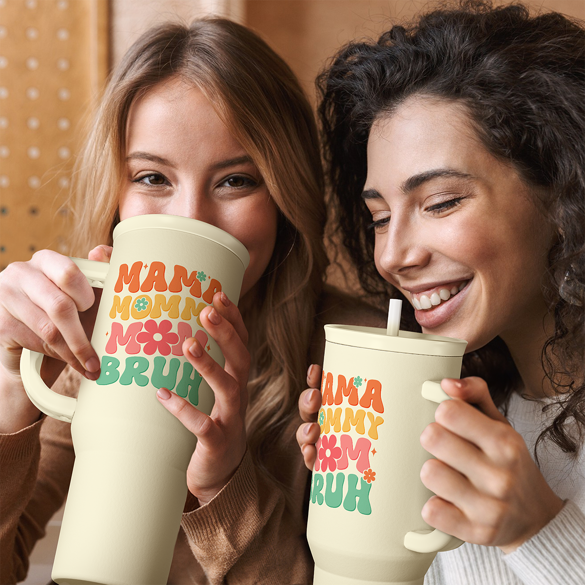 Cream handled tumbler with straw and “MAMA MOMMY BRUH” graphic, ready for sipping.
