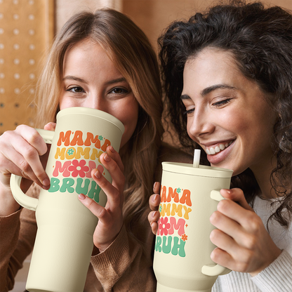 Cream handled tumbler with straw and “MAMA MOMMY BRUH” graphic, ready for sipping.