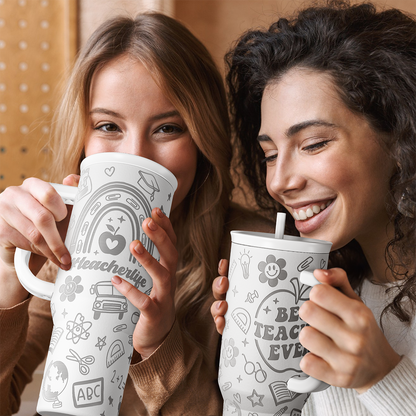 White 40oz tumbler with handle and teacher print, held while drinking through straw