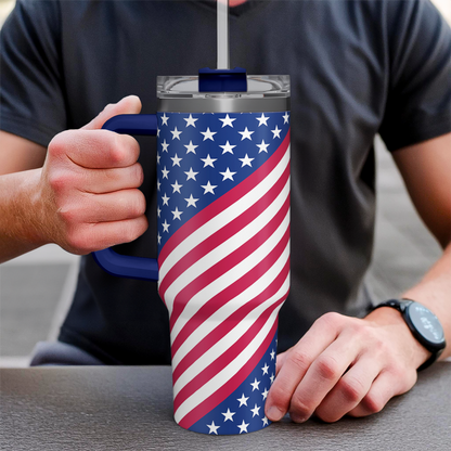 American flag 40oz tumbler with blue handle, held in hand