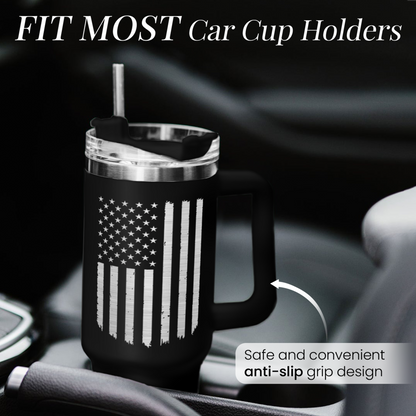 Black 40oz tumbler with handle and American flag print in car cup holder