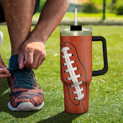 Brown football-themed 40oz tumbler with handle, black lid and white lacing graphic