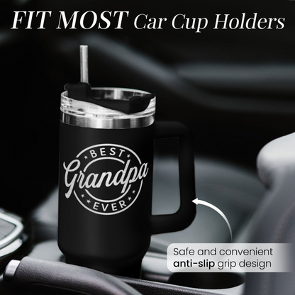 Black 40oz tumbler with handle and clear lid, placed in car cup holder