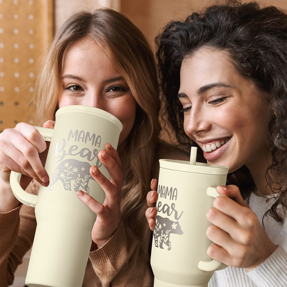 Beige 40oz tumbler with handle, straw, and “Mama Bear” graphic for drinking.