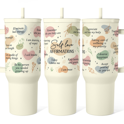 Beige 40oz slide-top tumbler set with reusable straw and carrying handle, printed quotes