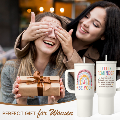 Pair of white 40oz slider tumblers with handles; “LITTLE REMINDER” and “BE YOU” prints.