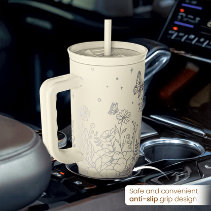 40oz beige floral tumbler with handle and sliding straw lid on a stovetop