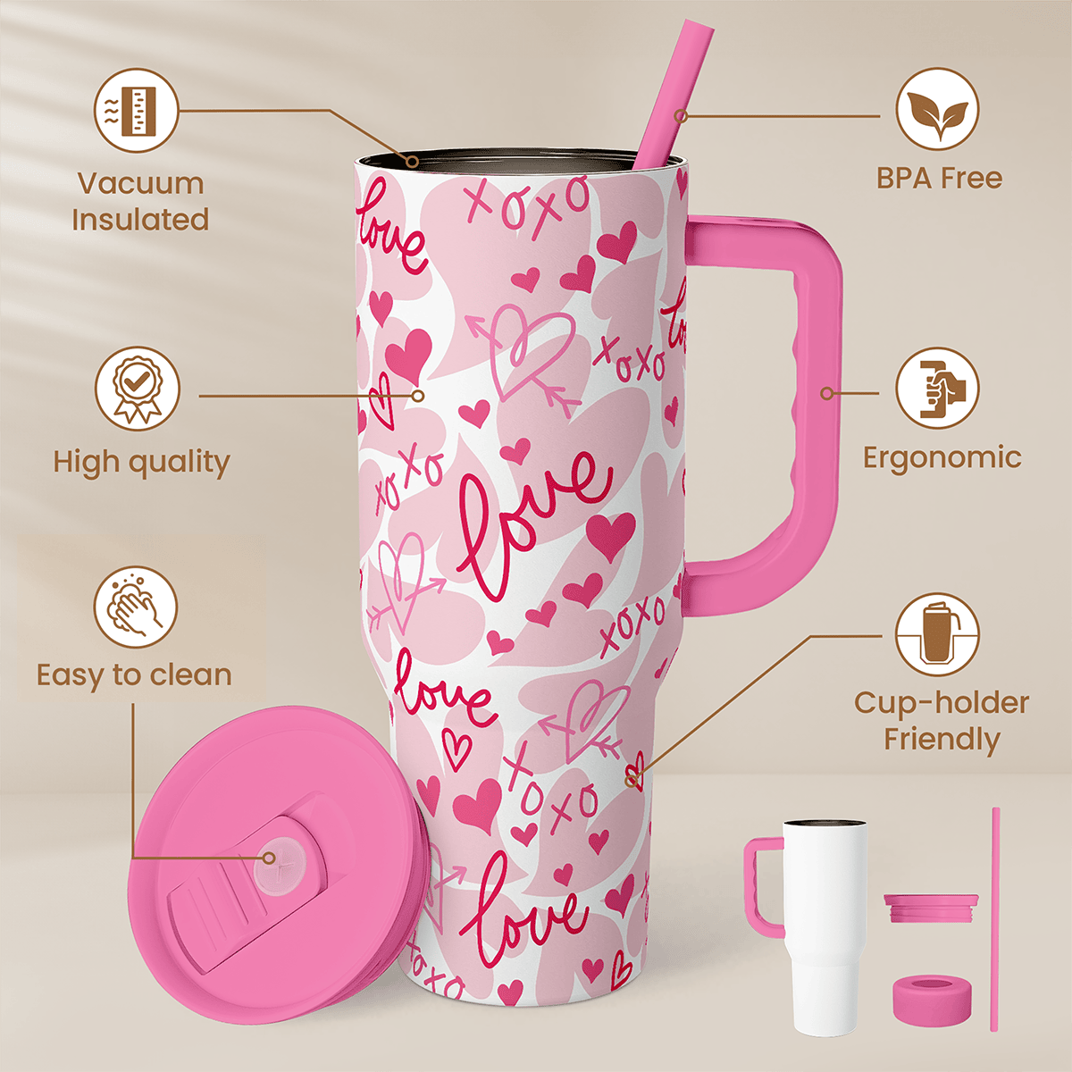 Pink 40oz tumbler with handle and straw, white with pink hearts and love lettering pattern.