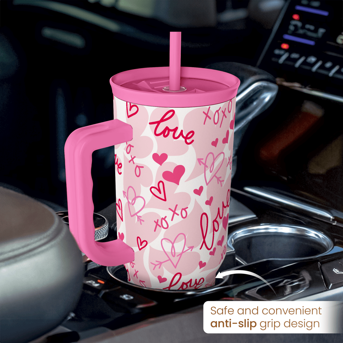 Pink 40oz tumbler with handle and straw, white with pink hearts and love pattern.