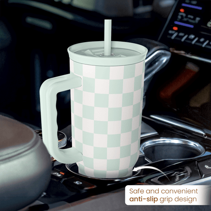 Mint checkered 40oz insulated tumbler with handle and straw on stove, anti-slip grip