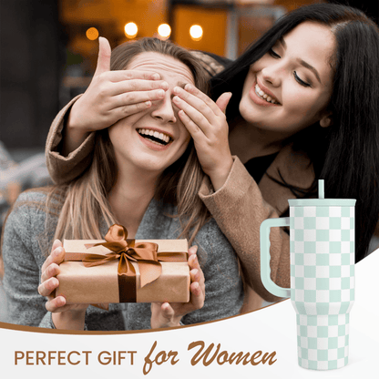 Mint checkered 40oz tumbler with straw beside two women opening a gift