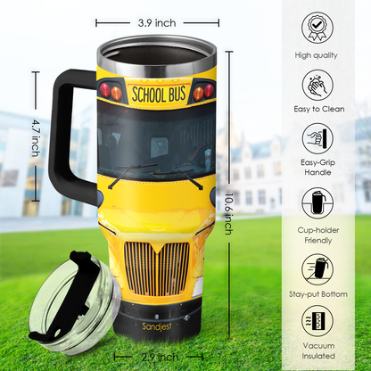 Yellow bus graphic tumbler with black handle, clear lid, and black straw