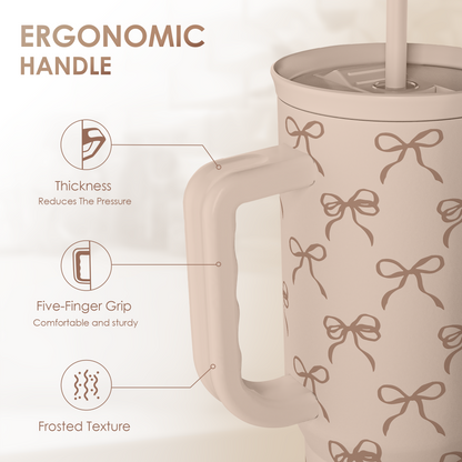 Ergonomic handle tumbler in light tan with brown bow pattern, slide lid and straw