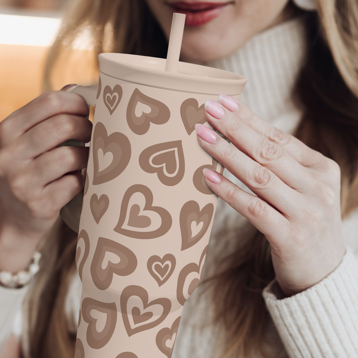 Brown heart-pattern tumbler with handle, straw, and sliding lid