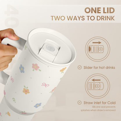 White floral 40oz tumbler with slider lid and straw inlet for two drinking options