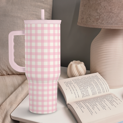 Pink gingham tumbler with lid and straw standing upright