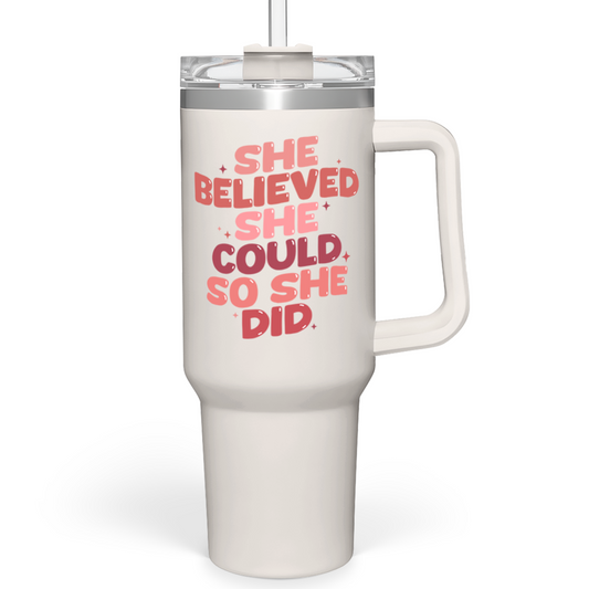 White 40oz tumbler with handle, red slogan graphic and clear lid.