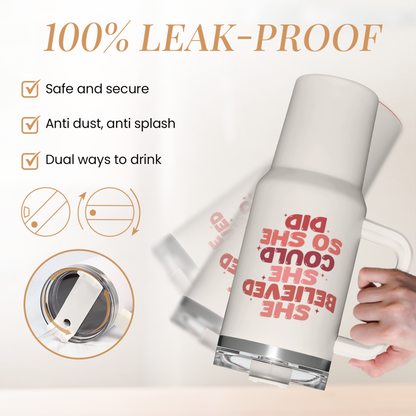 White 40oz tumbler with handle and leak-proof lid, red slogan graphic.