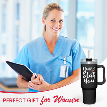 Black 40oz nurse tumbler with handle, held by nurse in scrubs
