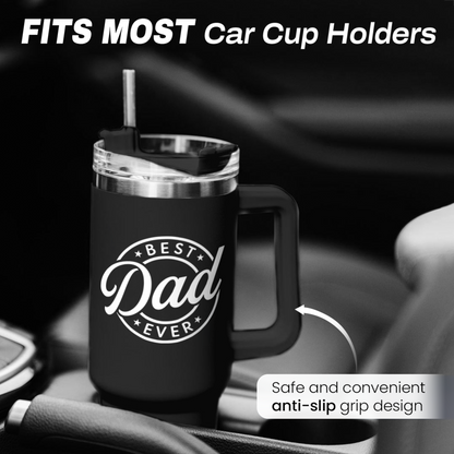 Black 40oz tumbler with handle in car cup holder; clear lid, “Best Dad Ever” logo.