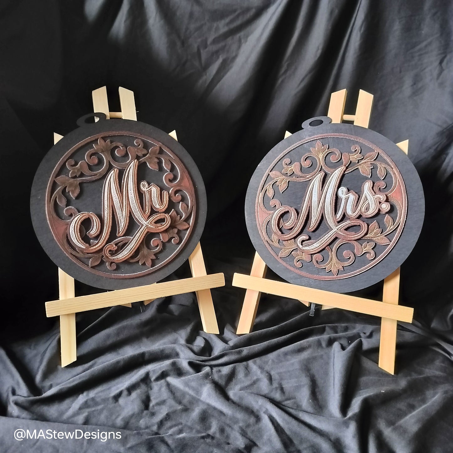 Set of 2 laser-engraved wooden chair signs with round dark bases and pale support bars