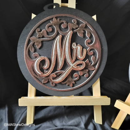 Laser-engraved wooden chair sign with round dark base and ornate Mr cursive