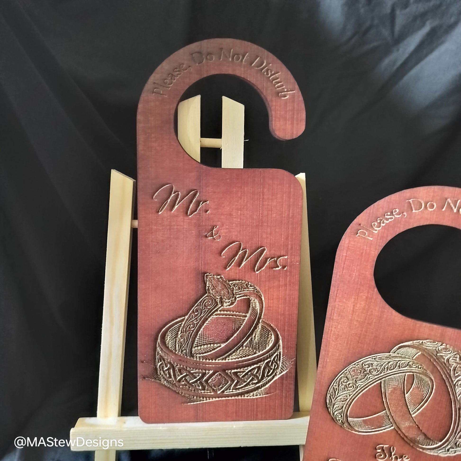 Wood door hanger with Mr and Mrs text and gold ring design.