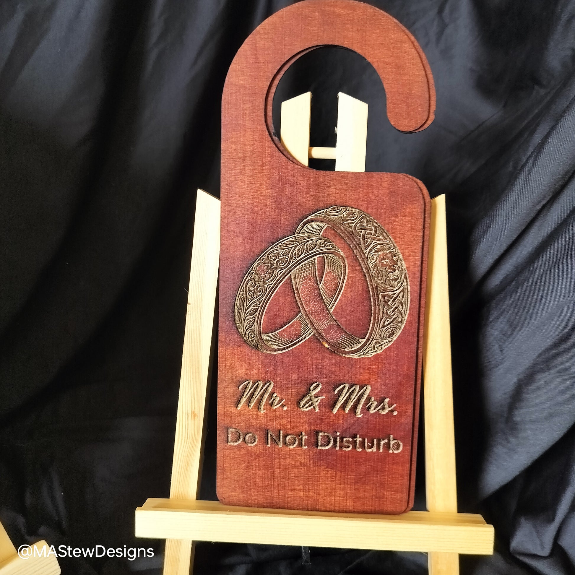 Wood door hanger with 'Mr. & Mrs' and 'Do Not Disturb' text plus ring design.