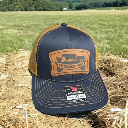 Navy trucker hat with tan mesh back, leatherette front logo patch, Richardson 112 label