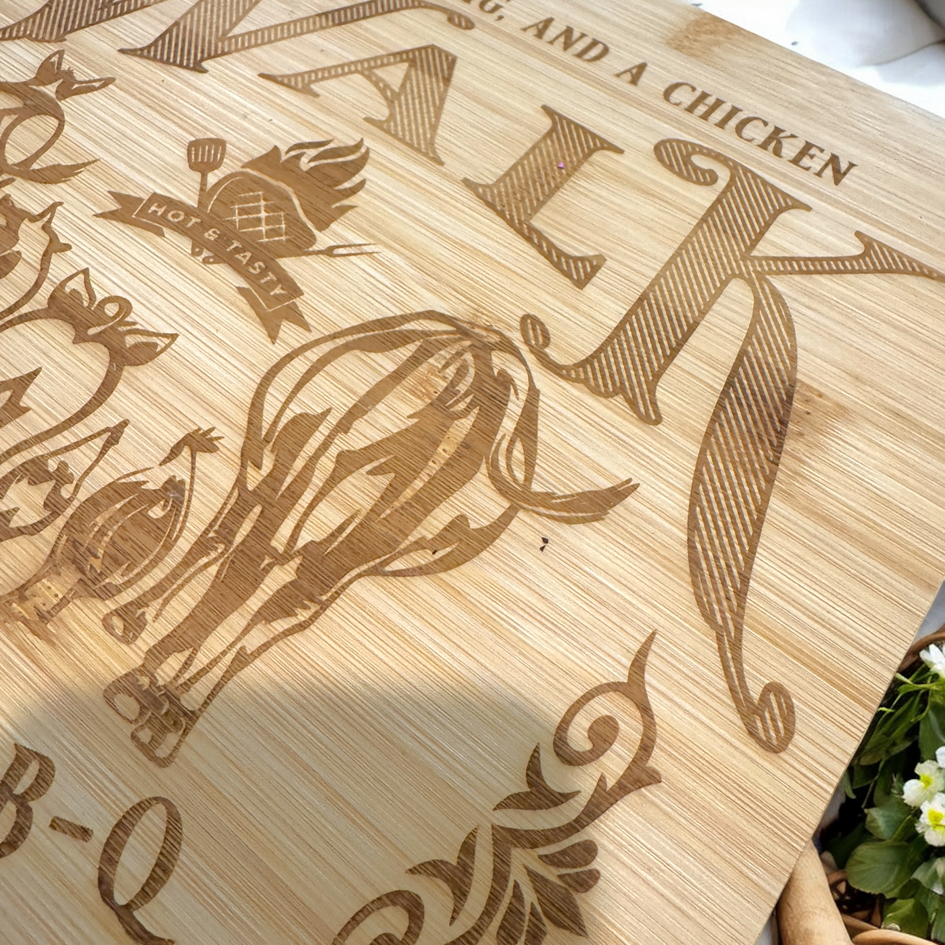 Bamboo cutting board with detailed engraved farm animals and “BAR-B-Q” text