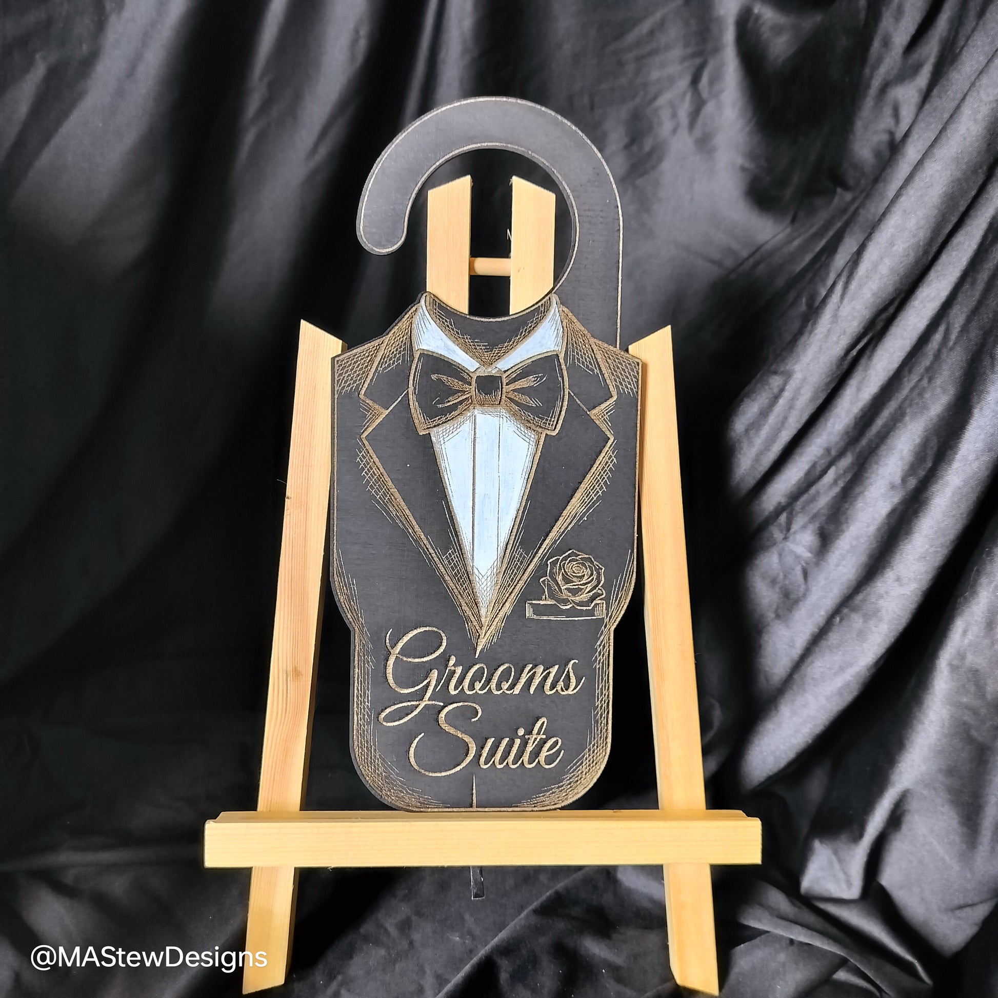 Laser-engraved wood door hanger with tuxedo silhouette and 'Grooms Suite' text.
