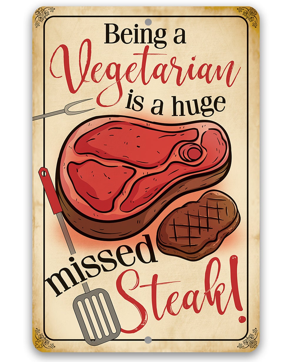Vegetarian slogan metal sign featuring red steak and brown grill steak, gold frame.