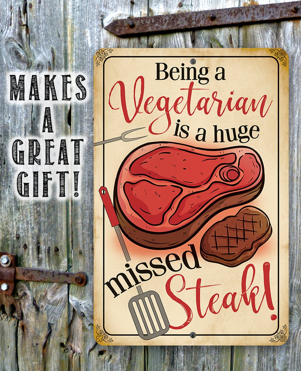Vegetarian slogan metal sign with red steak and fork/knife graphic, gold border.