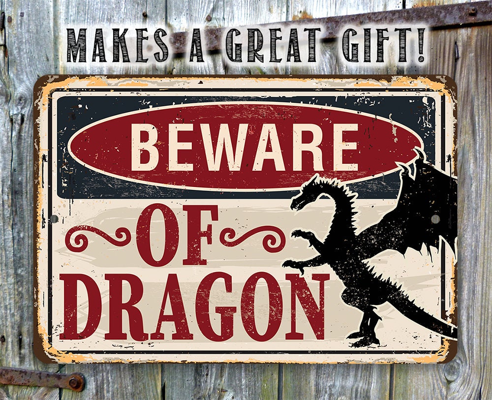 Distressed “BEWARE OF DRAGON” metal sign on rustic wood background