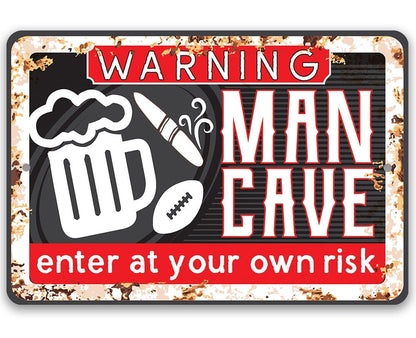 Warning “Man Cave” metal sign with “Enter at your own risk” text
