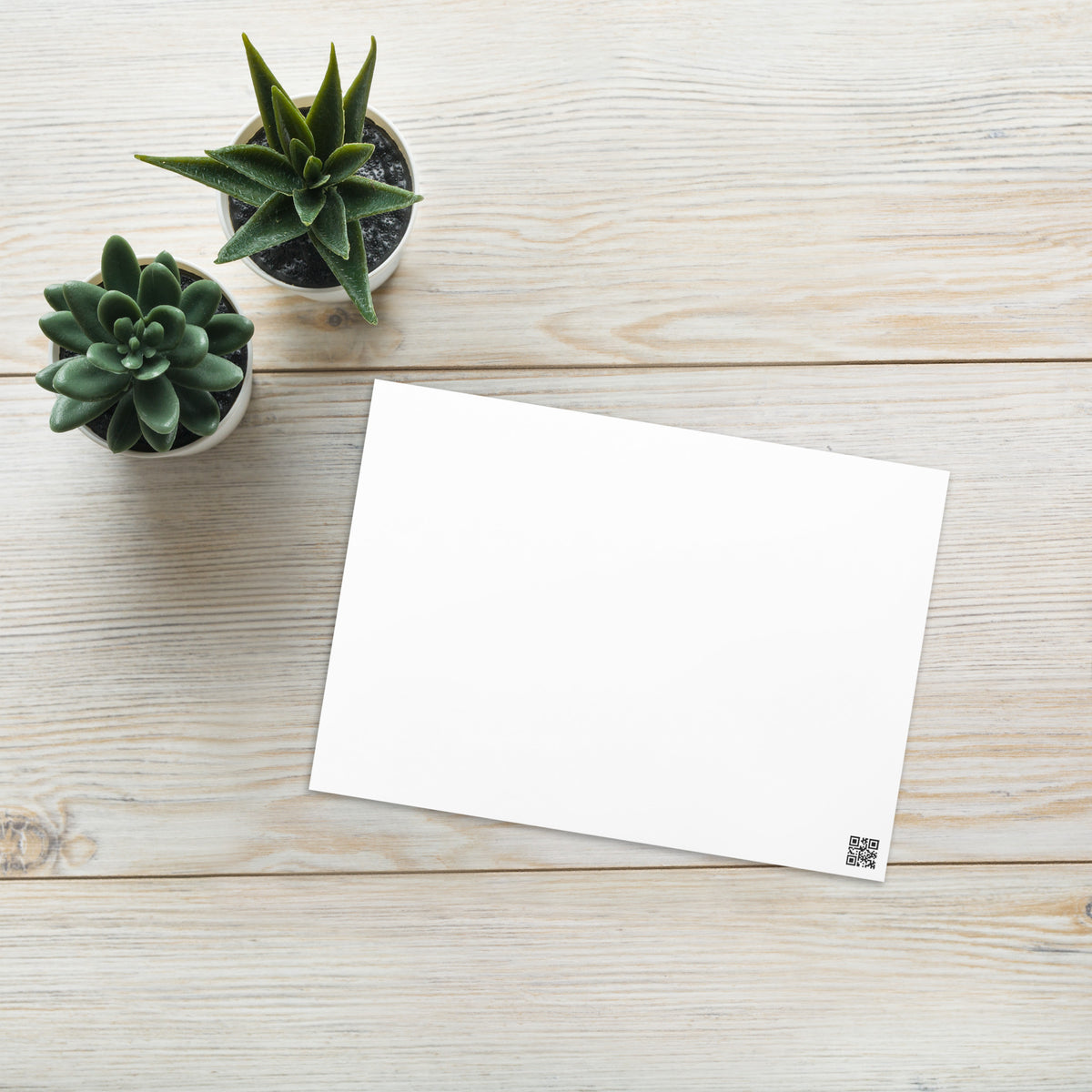 Blank greeting card back, white front side with small barcode-style mark