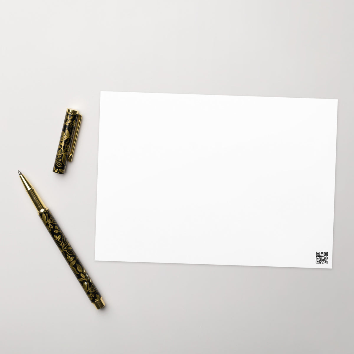 White greeting card back, plain front with QR code in bottom-right corner