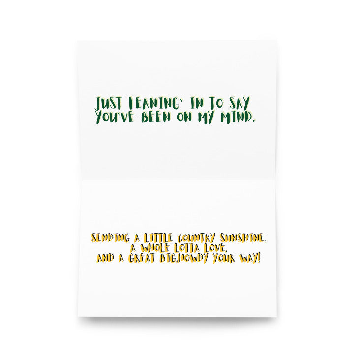 Front of greeting card with green text quote and orange verse below