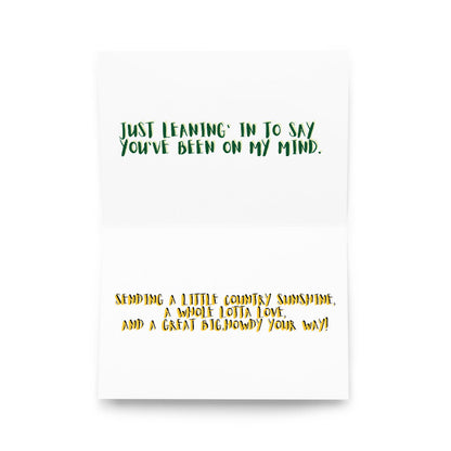 Front of greeting card with green text quote and orange verse below