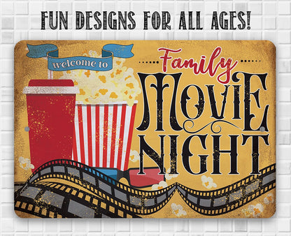 Rectangular metal wall sign: "Welcome to Family Movie Night" with popcorn and film strip art