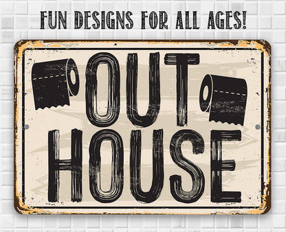 Distressed metal sign with “OUT HOUSE” lettering and toilet-paper icon graphics