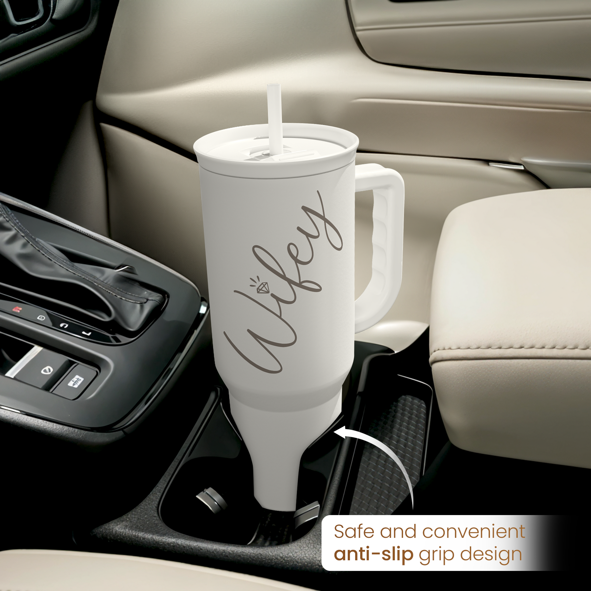 White tumbler with handle and straw, anti-slip grip design shown in car console