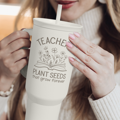 White 40oz tumbler with handle and straw, TEACHER plant seeds graphic
