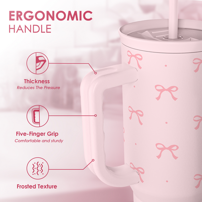 Pink tumbler with ergonomic handle and straw, bow pattern all over