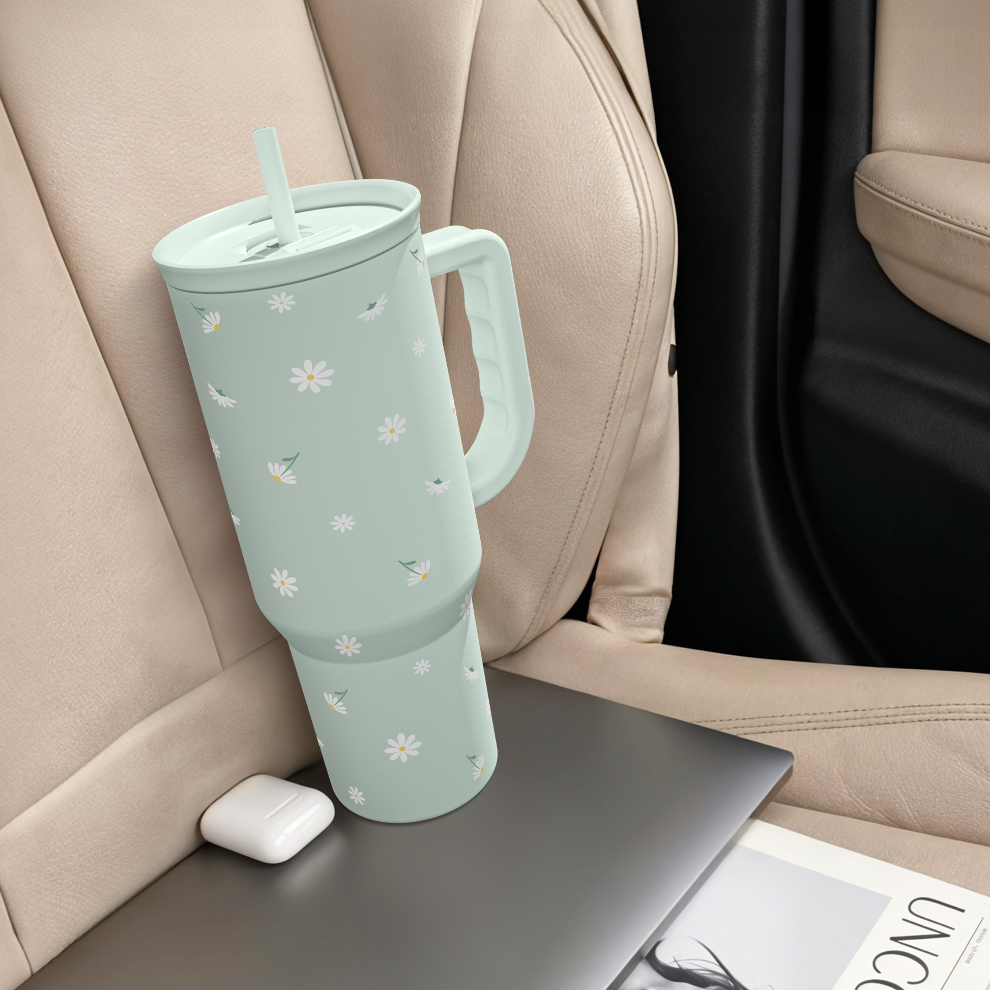 Mint daisy 40oz tumbler with straw and side handle on seat console