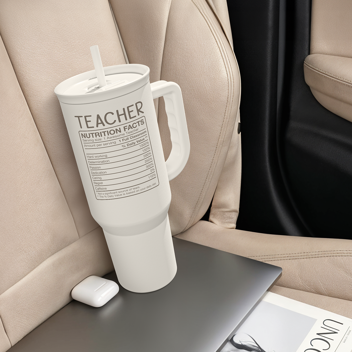 White 40oz tumbler with handle and straw, TEACHER nutrition facts label in car